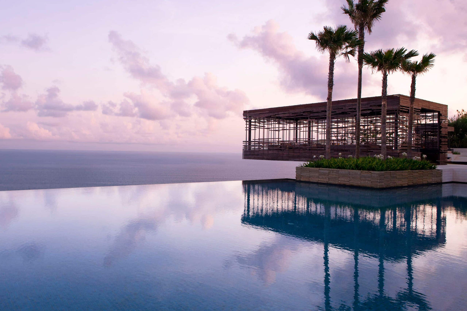 The cliff-edge Sunset Cabana at Alila Villas Uluwatu at sunset, Bali