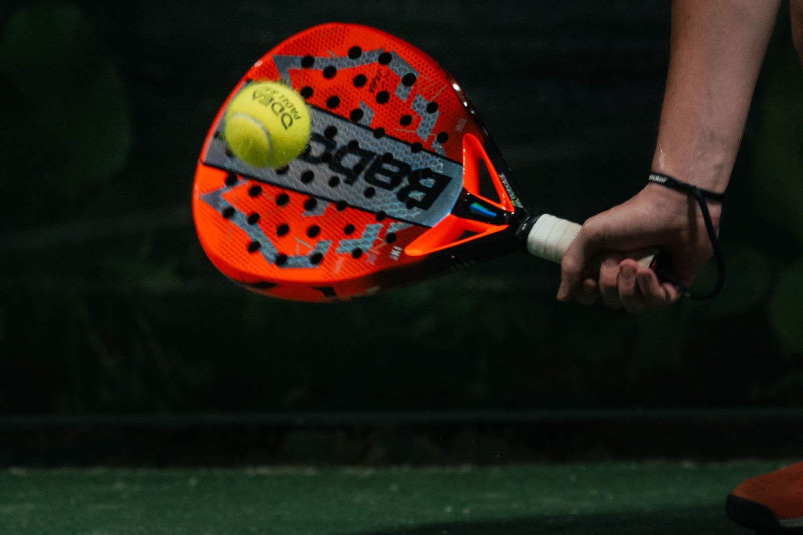 Azoria padel racket and ball in hand on court in Uluwatu