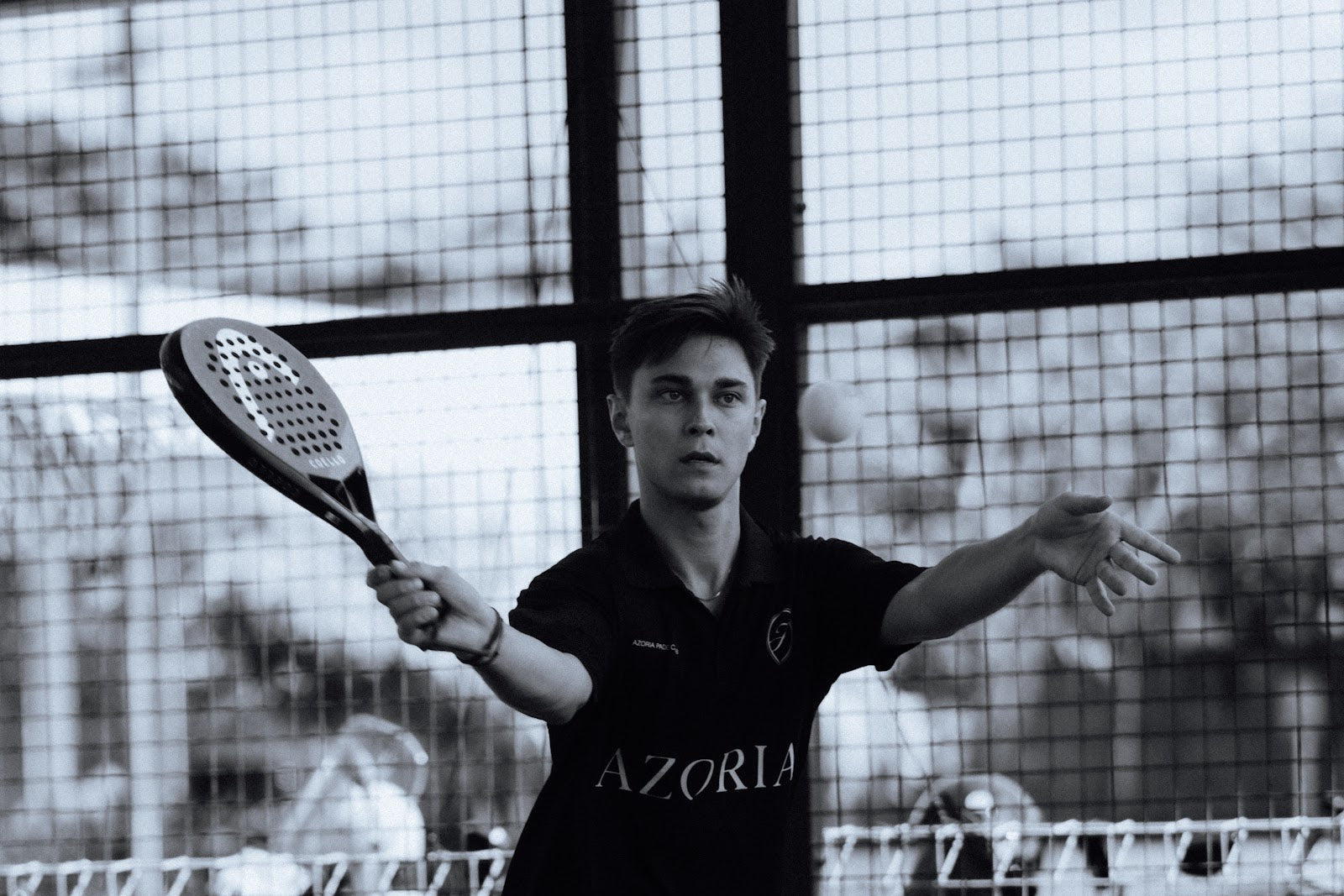Padel player preparing an overhead bandeja shot in Uluwatu