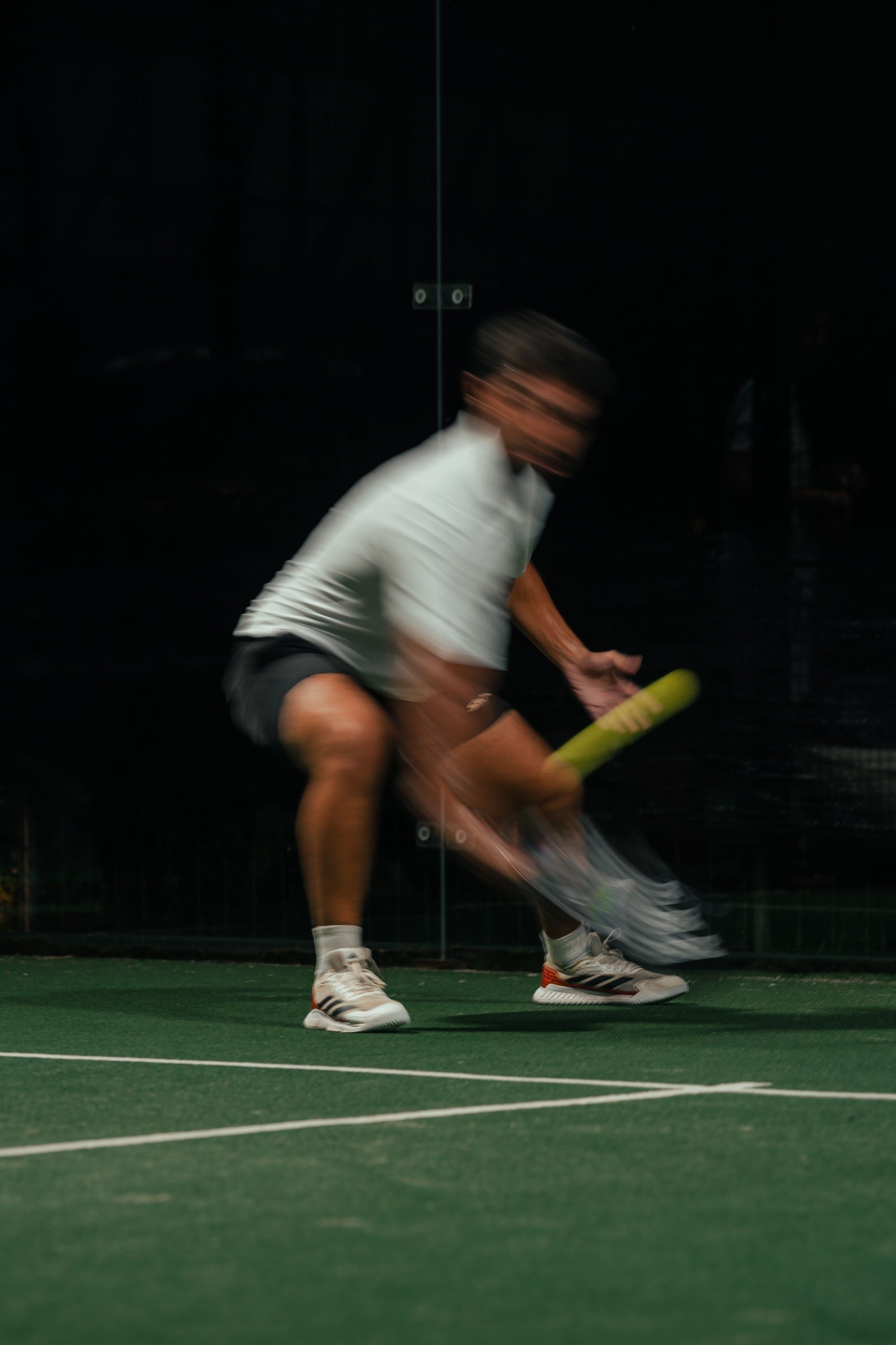 Padel player backhand glass cage — Azoria, Uluwatu, Bali