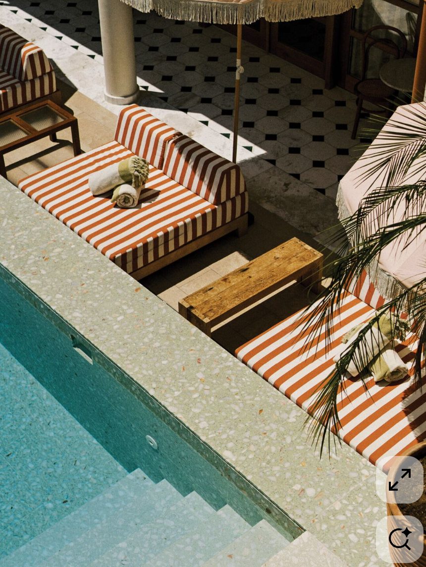 Wellness recovery: striped poolside loungers terrazzo — Azoria, Uluwatu, Bali